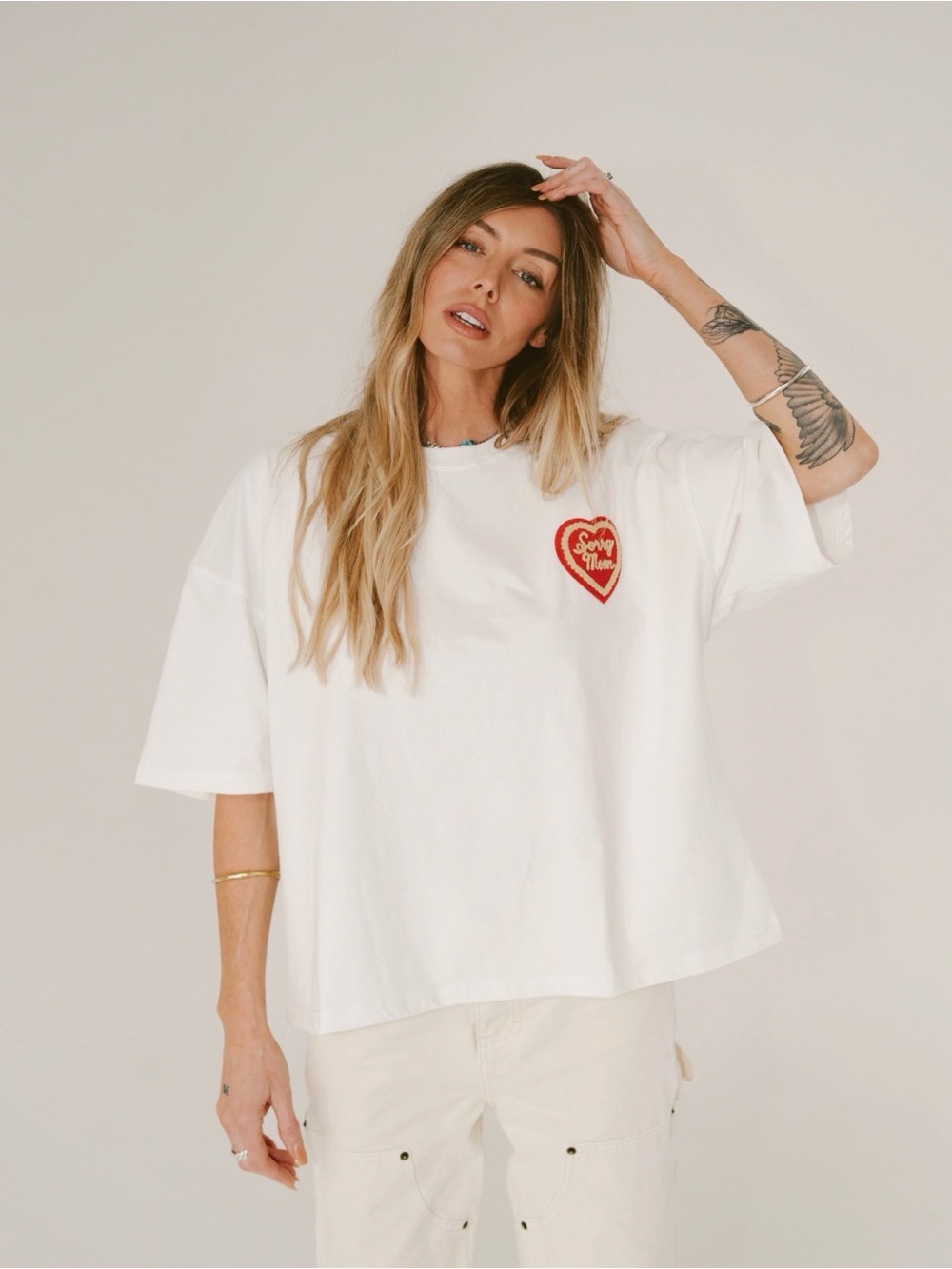 White Women's Oversized Graphic Tee with Red Heart Patch- Happy Little Mother